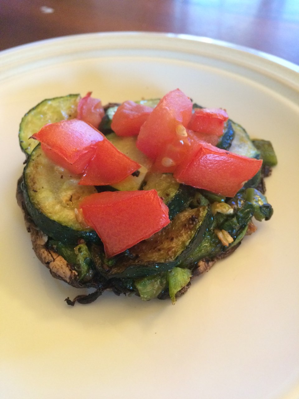 Portobello mushroom with zucchini, tomato, spinach, green peeper, and