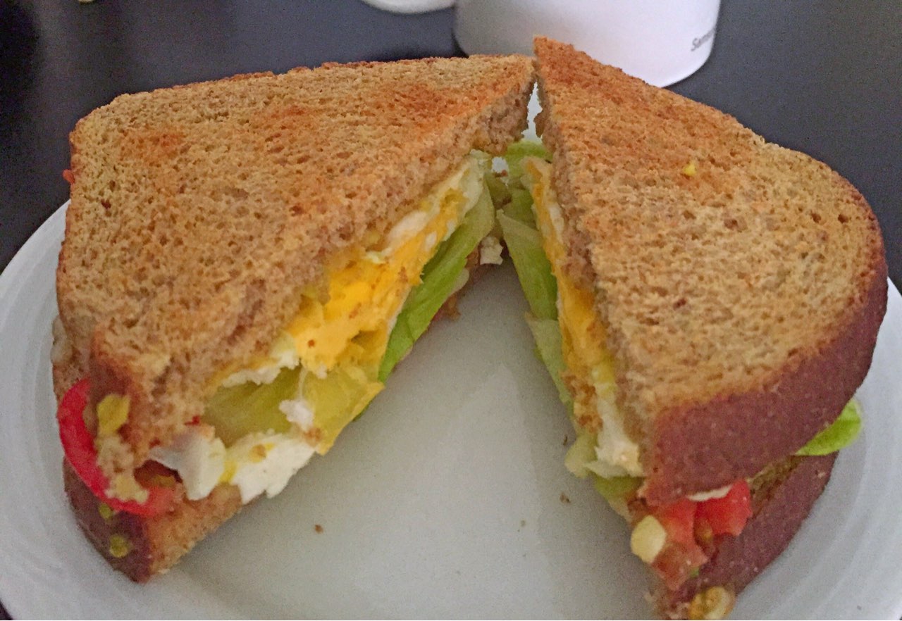 Whole wheat light bread, egg, tomatoes, avocado, lettuce & mozzarella