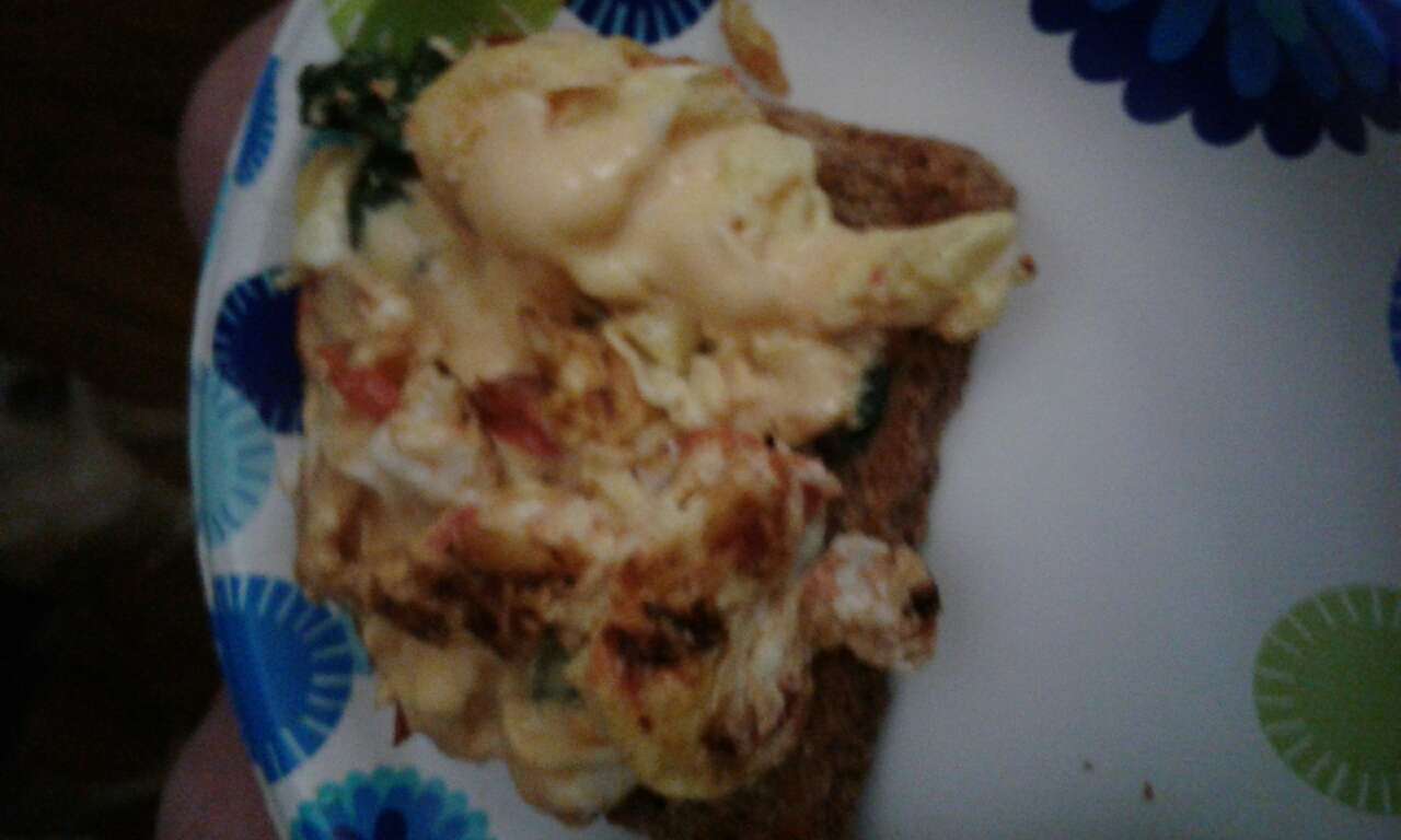 Breakfast for dinner! Toasted Ezekiel bread, 2 eggs, spinach, cheese