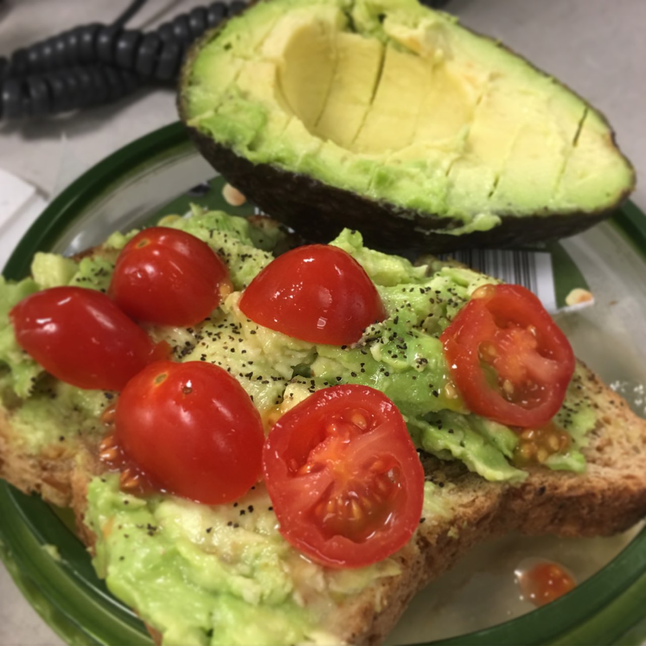 Avocado on toast (sprouted grain bread) with tomato the best