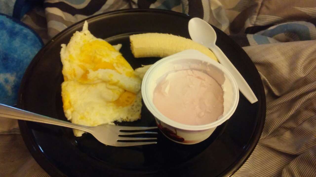 Breakfast, eggs over easy, banana and Greek cherry yogurt! Fooducate
