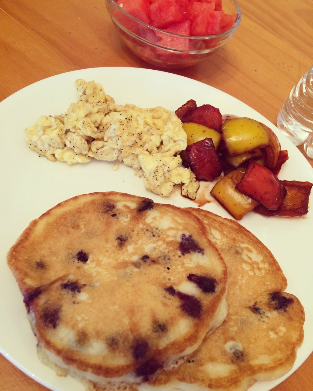 Fresh blueberry pancakes, sautéed veggies and 1 egg yolk with 2 egg whites 😋 watermelon too 🍉