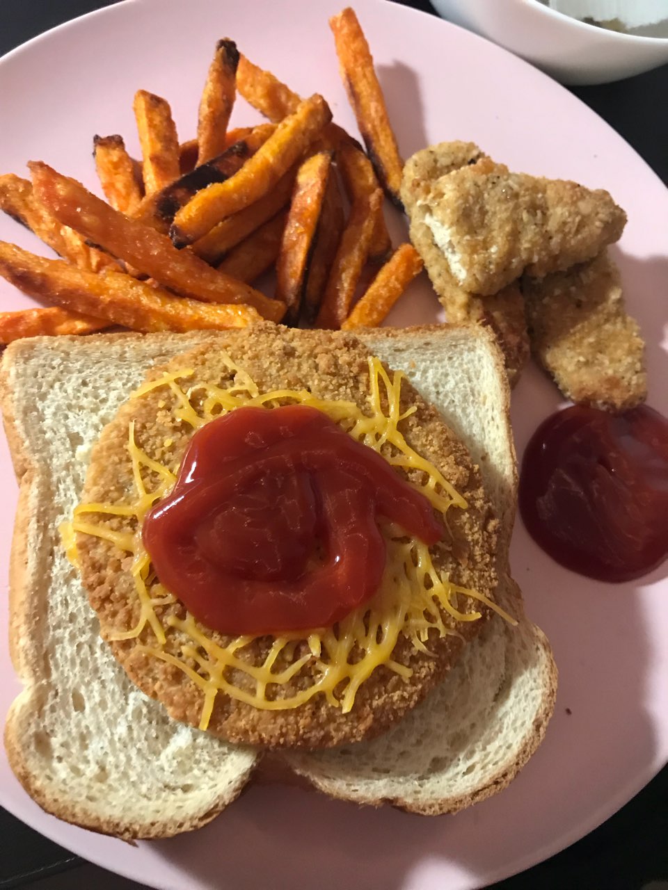 Veggie chicken burger, some veggie chicken nuggets and some sweet