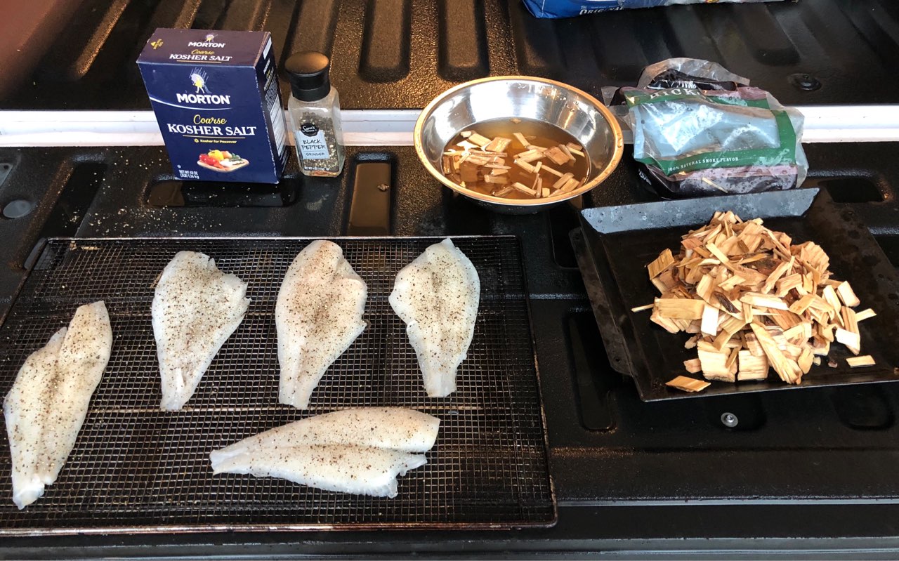 Getting ready to smoke some fish. Smoked flounder fillets over hickory