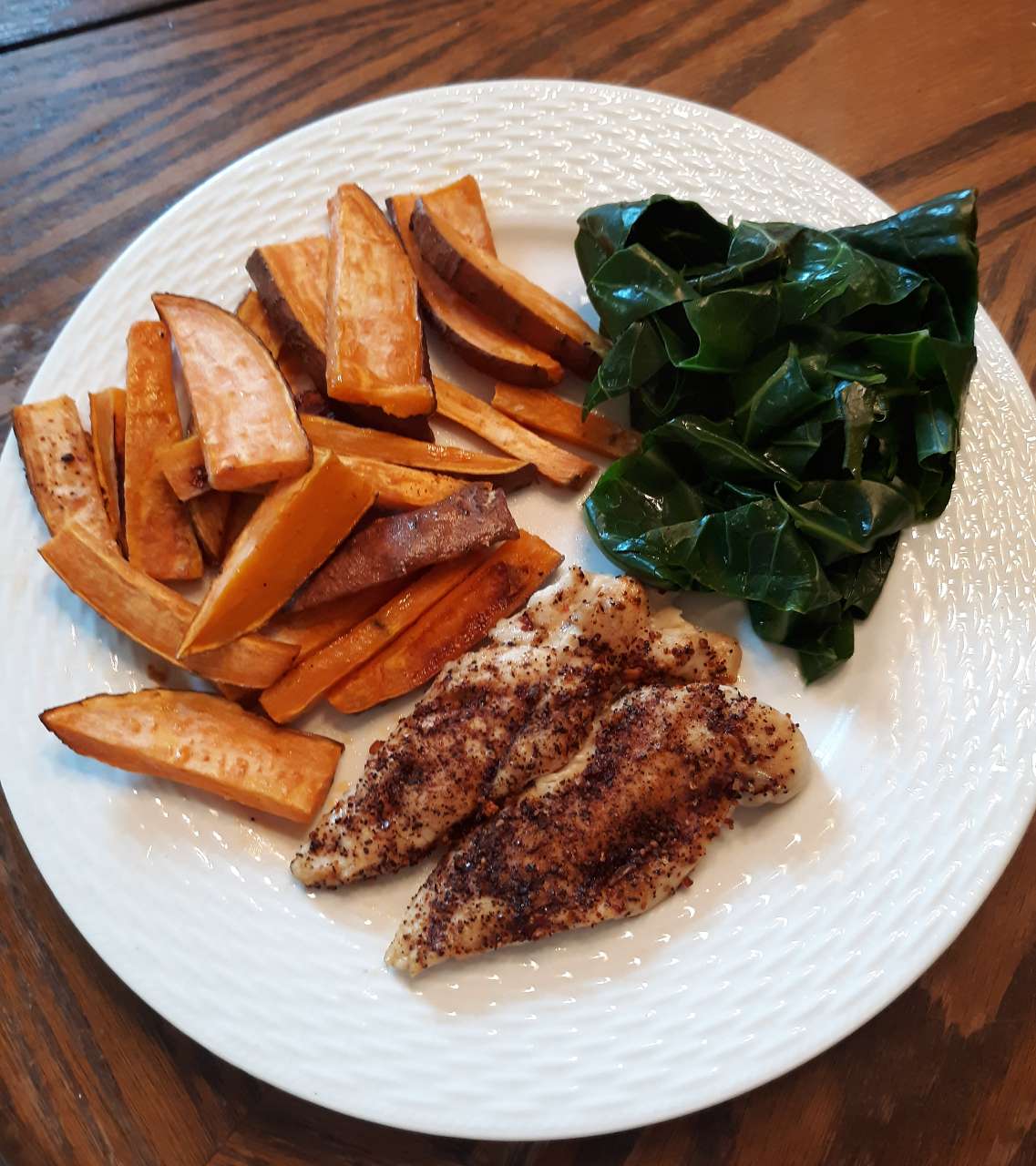 Simple dinner of baked chicken, sweet potatoes, and collard greens