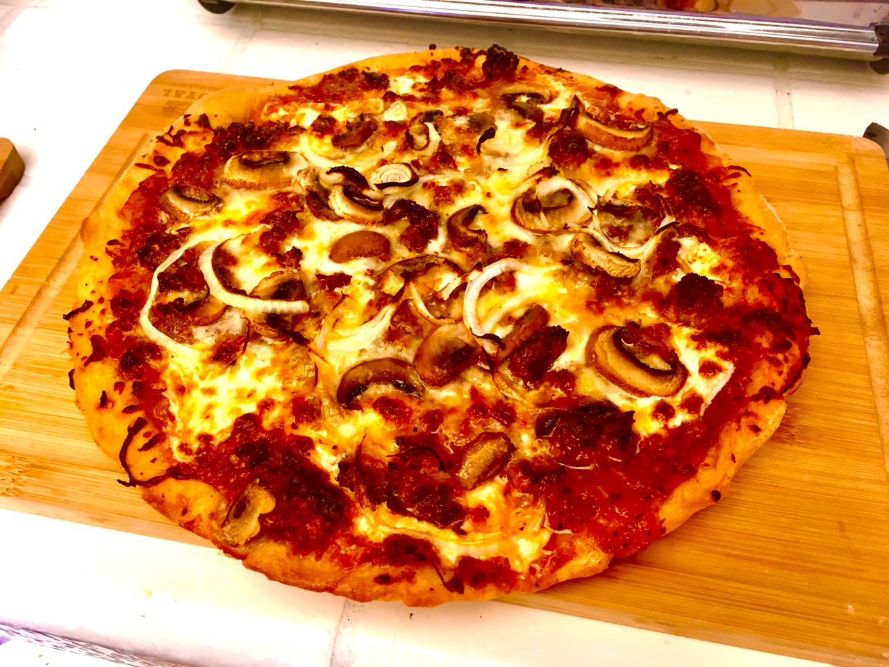 Pizza with sausage, mushrooms, onions, and cheese. Fooducate Diet Motivation