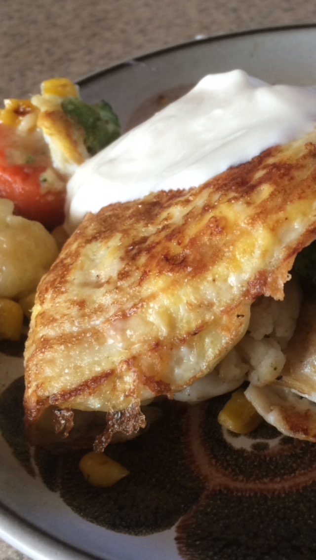 I stuffed this omelette with sautéed corn, broccoli, cauliflower, and