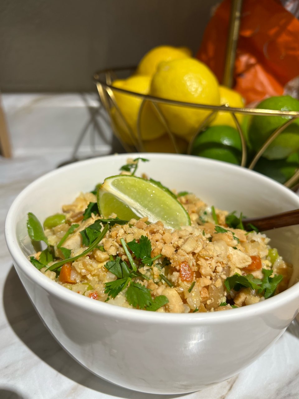 Khao Pad (Thai tofu fried rice). Lime, crushed peanuts and cilantro are