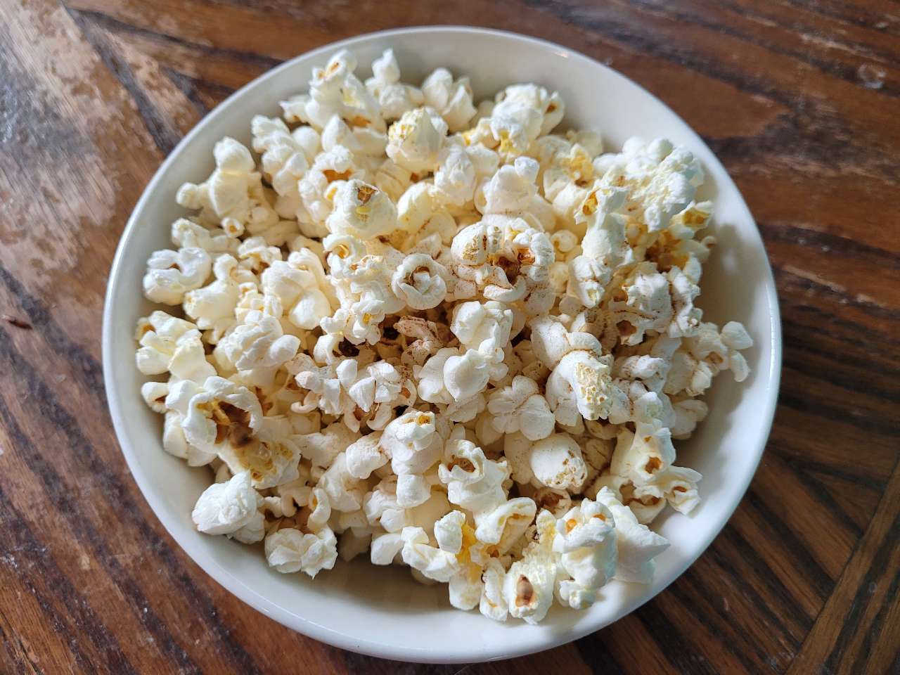 Stovetop popcorn (no oil necessary). Just place 2 Tbsp in a medium pot