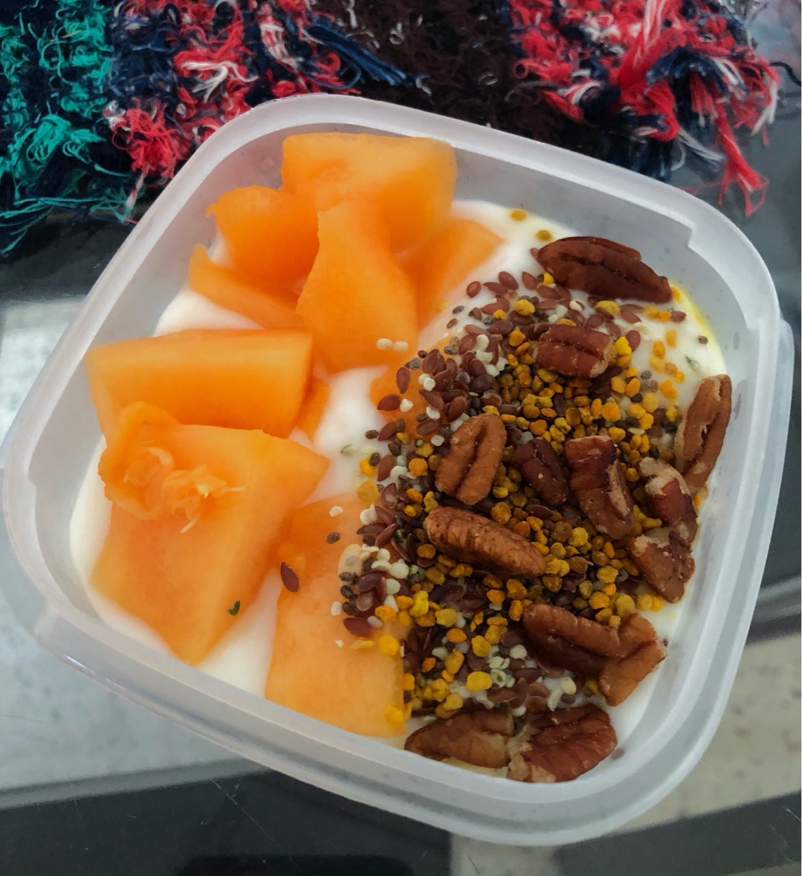 Breakfast today! Some light banana cream pie yogurt by Yoplait, cantaloupe,pecans , trilogy flax
