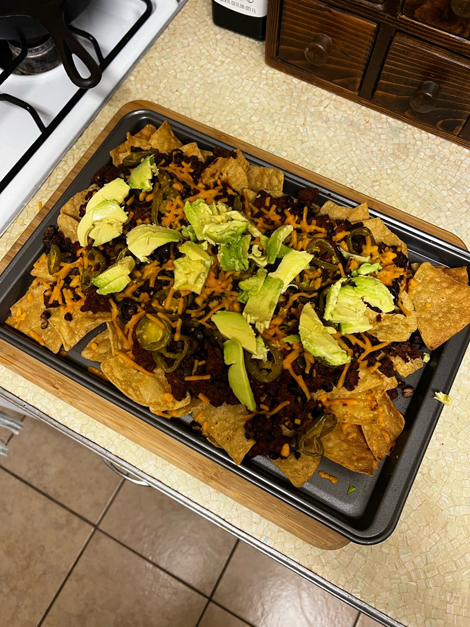 Vegan Nachos made at home with…… Ground “beef” Black beans Black olives