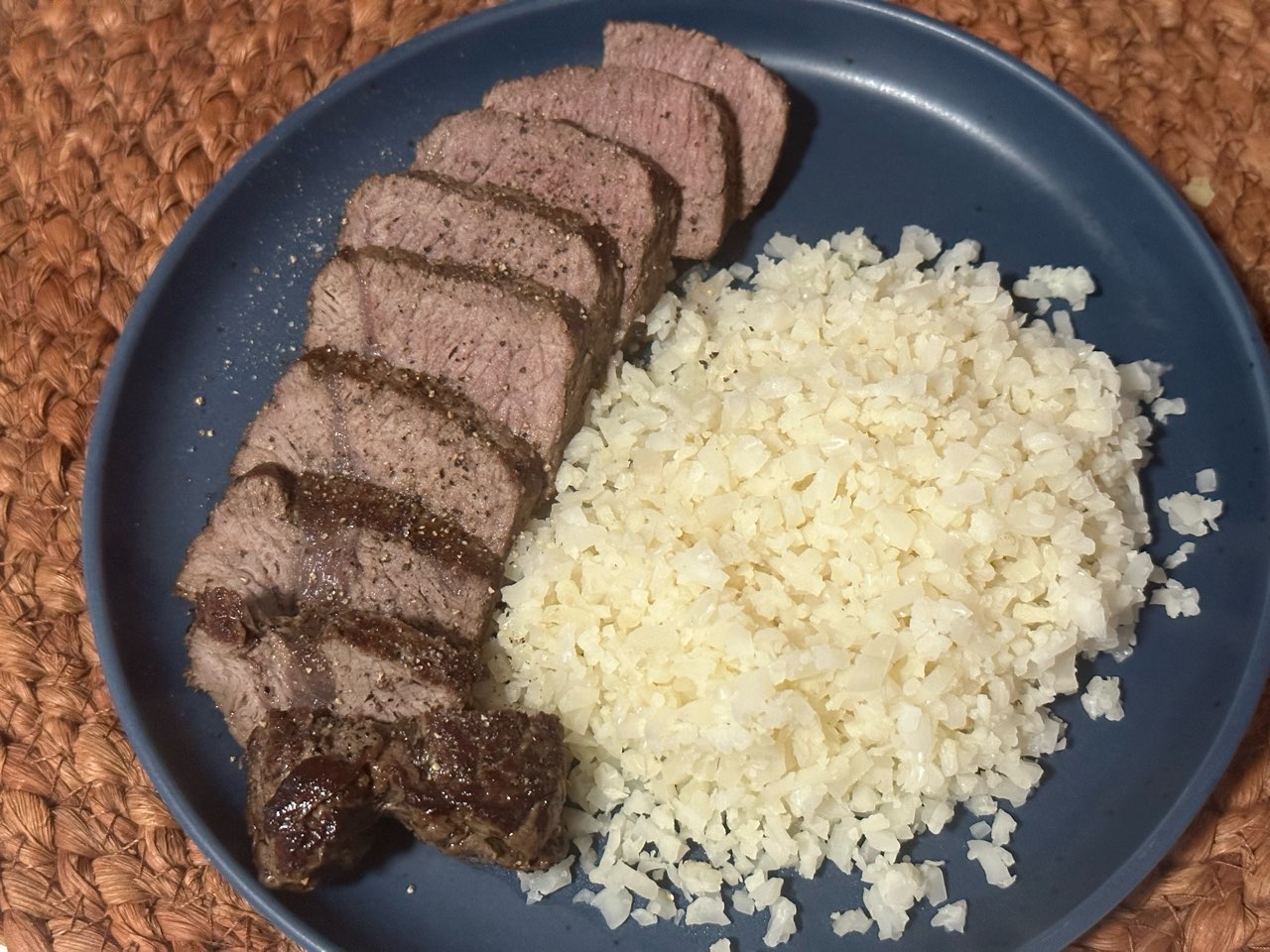 Dinner. Grass fed sirloin steak and cauliflower rice. I the steak under the broiler so it