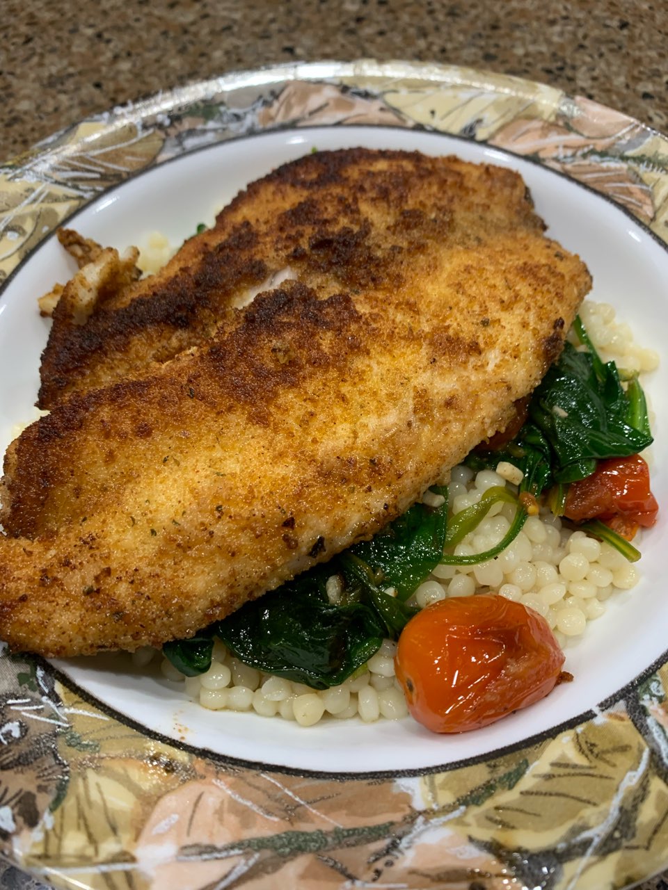 Tilapia with couscous,spinach and blistered tomatoes Directions